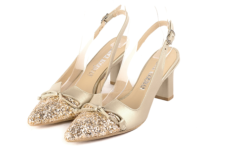 Gold women's open back shoes, with a knot. Tapered toe. High slim heel. Front view - Florence KOOIJMAN